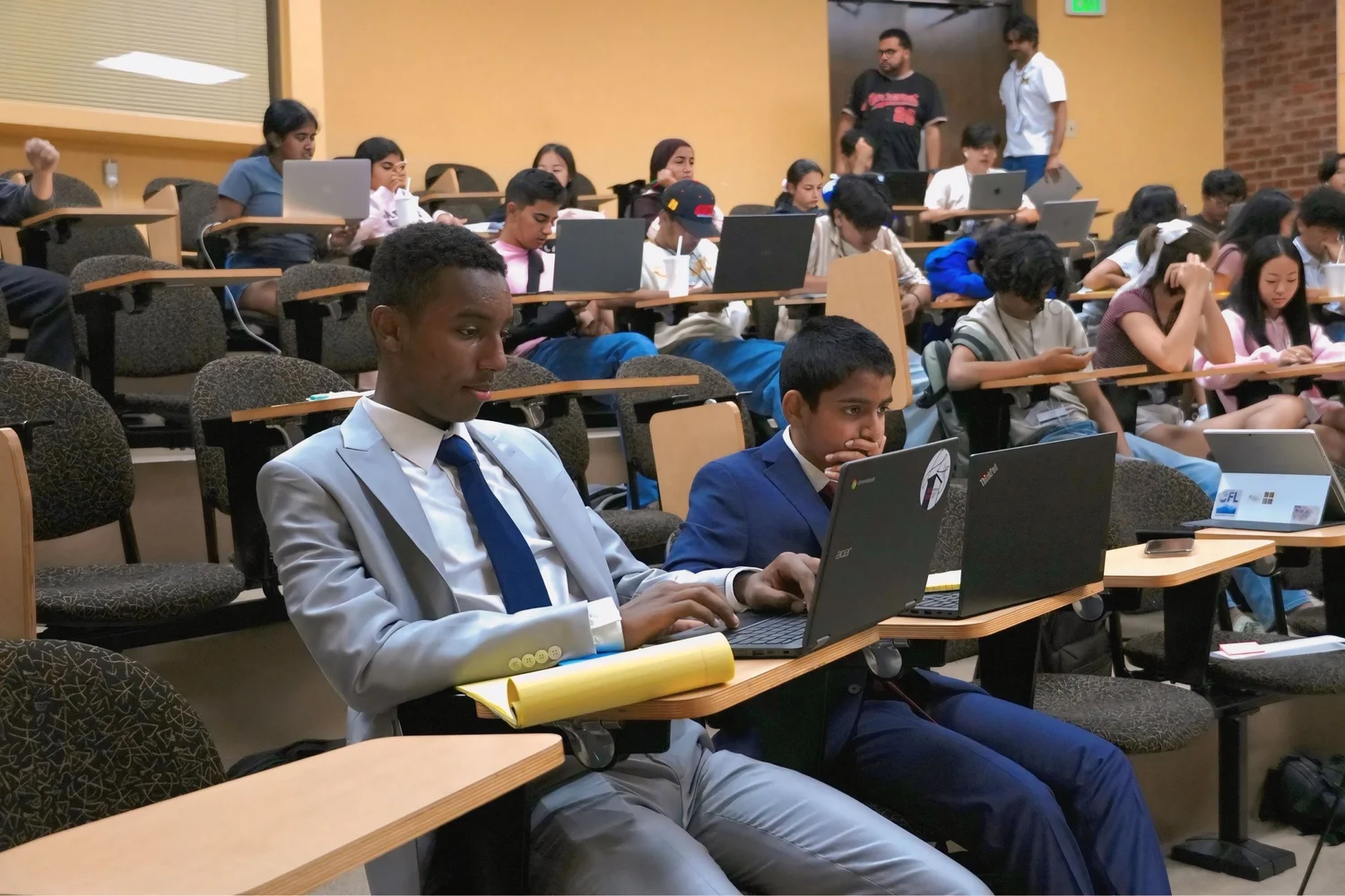 Students working with laptops in lecture